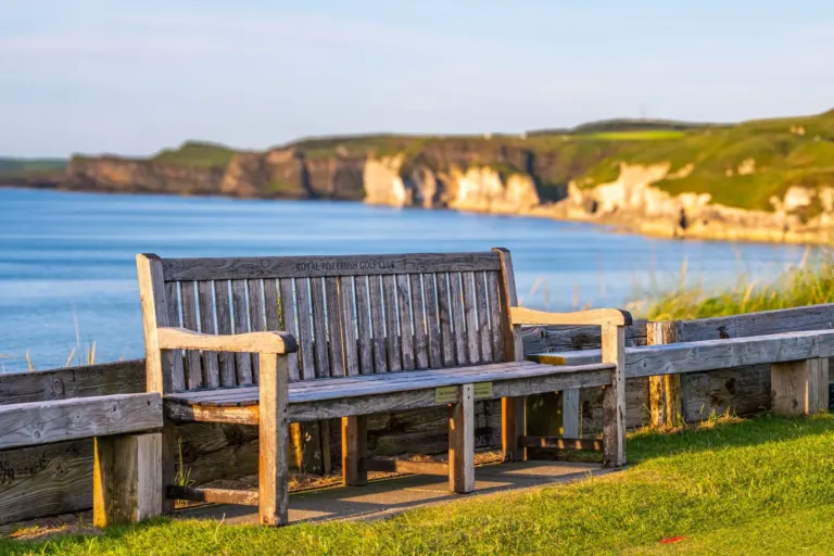 Royal Portrush Golf Club bench overlooking the Causeway Coast