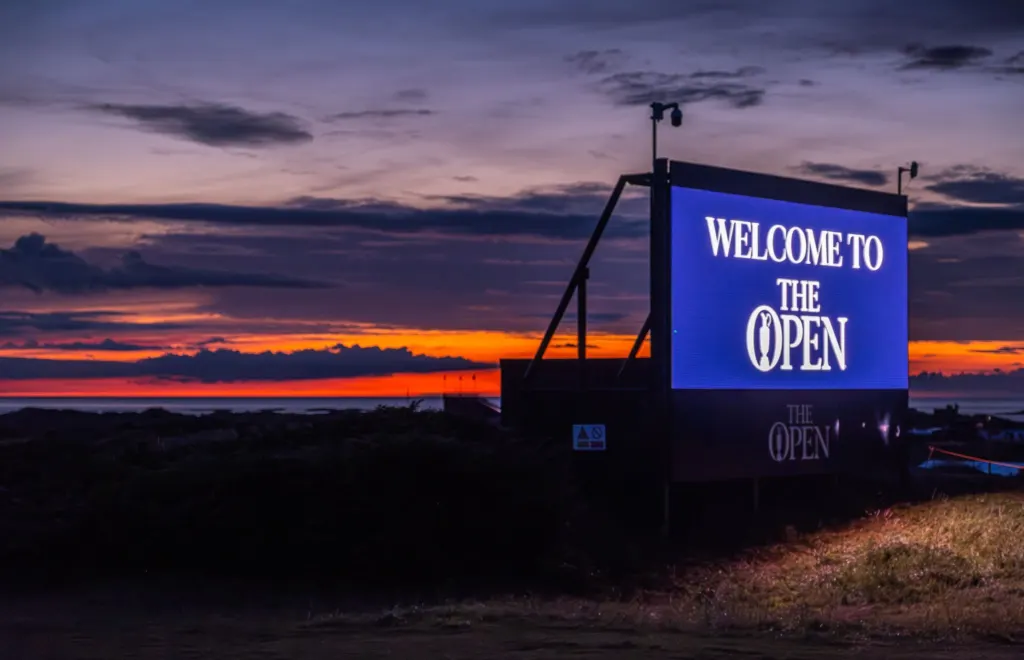 Welcome to The Open LED screen at dusk, with a CCTV camera on the tower