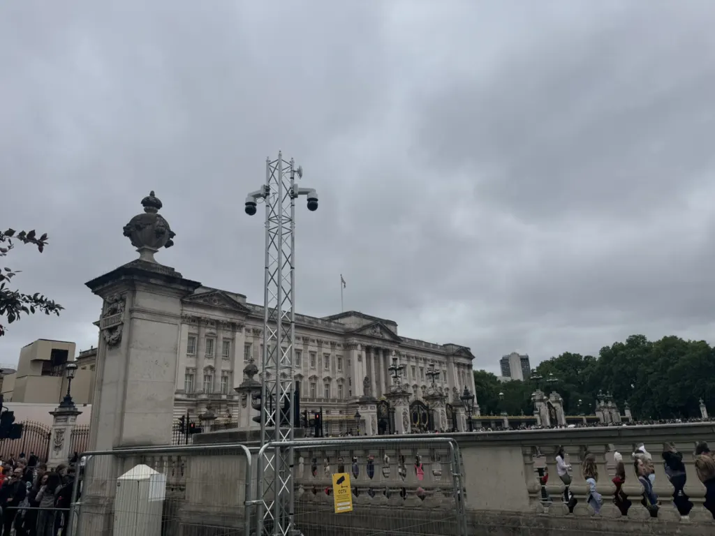 CCTV tower on the Victoria Memorial railings as the guards pass Buckingham Palace