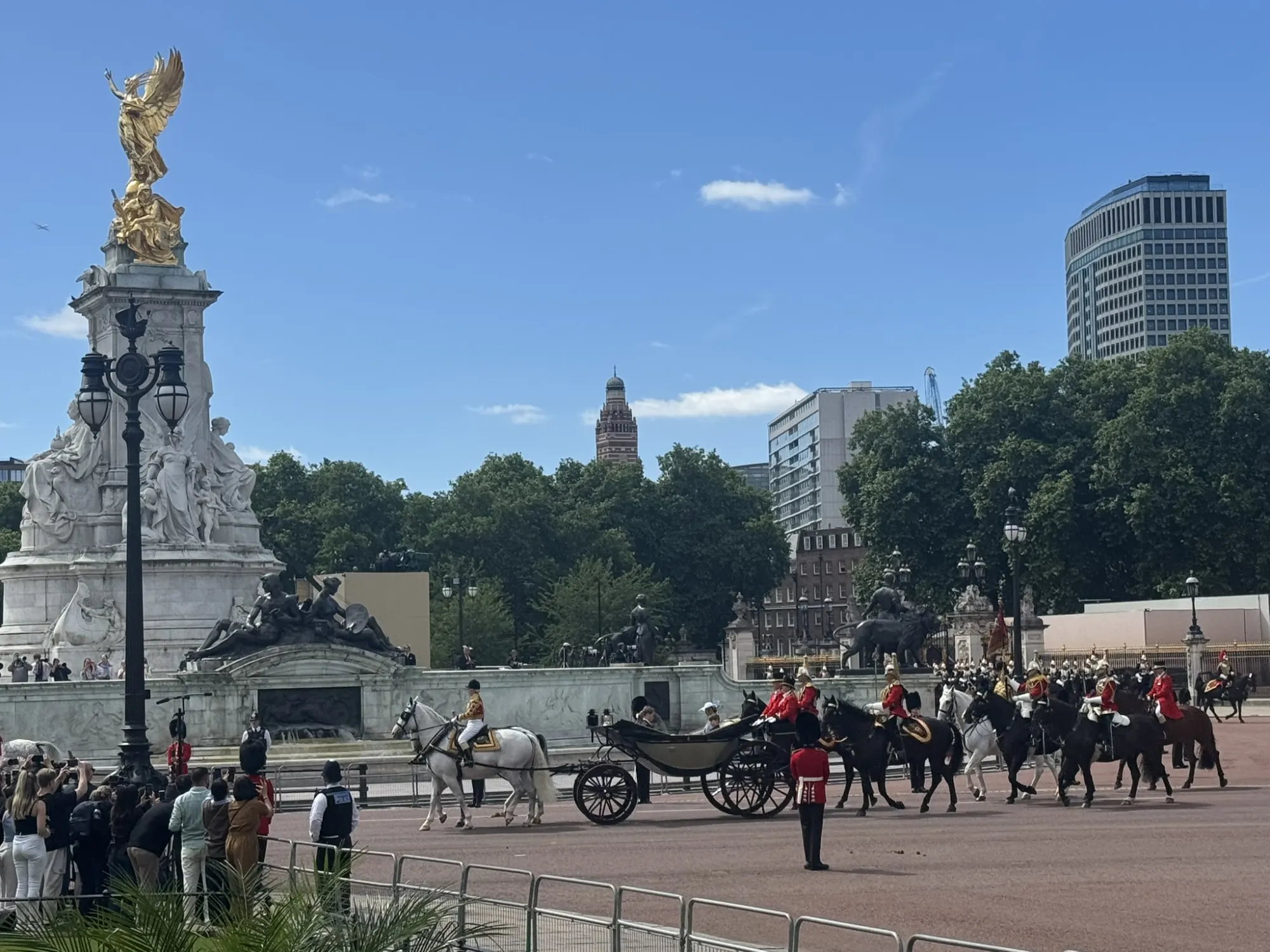 A carriage passes the Victoria Memorial during Trooping the Colour